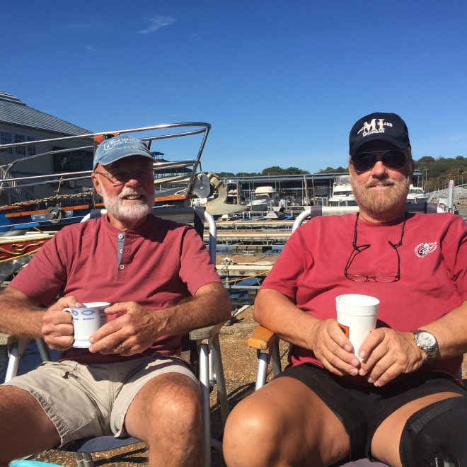 Captains Jim and Ron catching up with coffee on the dock.